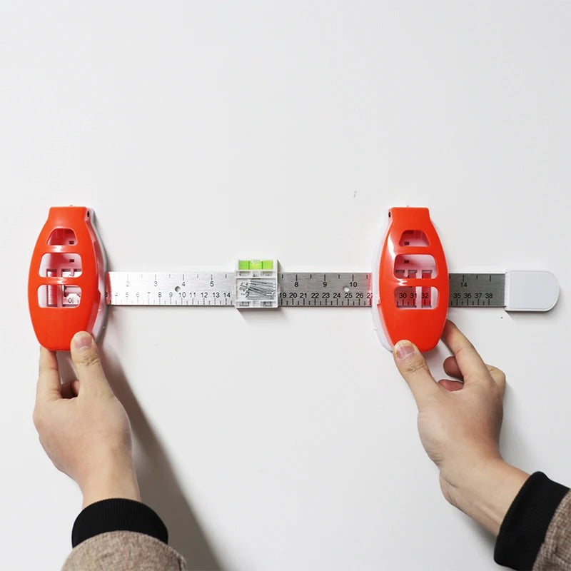 The All-in-One Frame Leveling Tool That Ends Crooked Pictures, Extra Nail Holes, and Wall Patch-Ups for Good