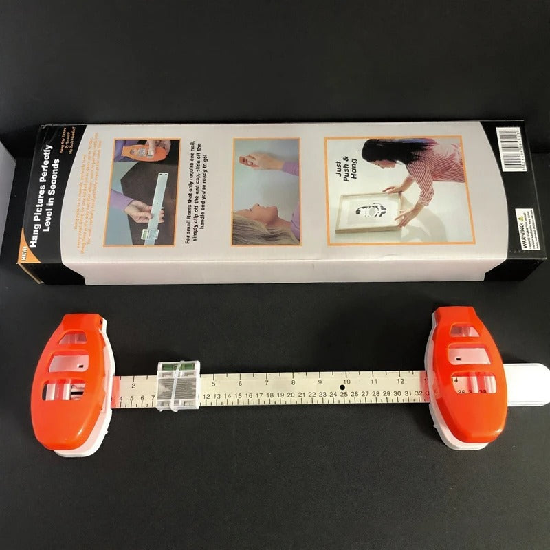 The All-in-One Frame Leveling Tool That Ends Crooked Pictures, Extra Nail Holes, and Wall Patch-Ups for Good