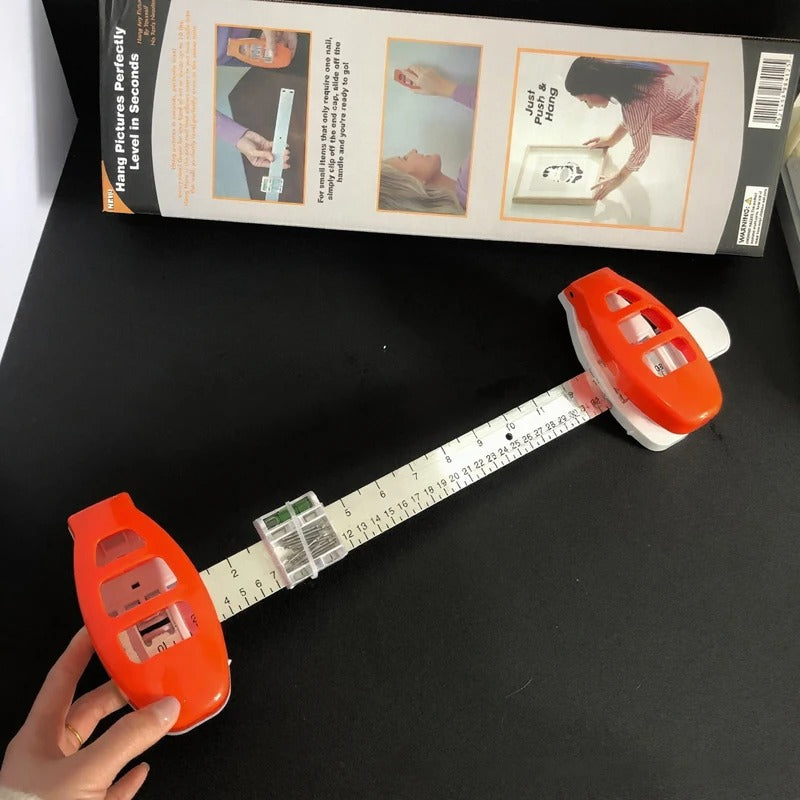 The All-in-One Frame Leveling Tool That Ends Crooked Pictures, Extra Nail Holes, and Wall Patch-Ups for Good