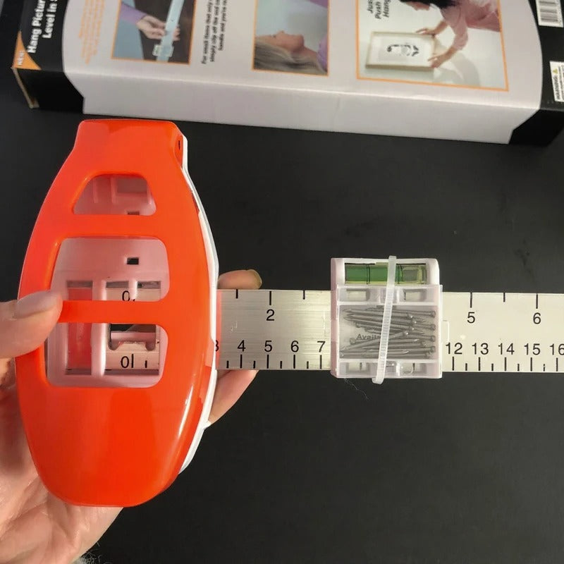 The All-in-One Frame Leveling Tool That Ends Crooked Pictures, Extra Nail Holes, and Wall Patch-Ups for Good