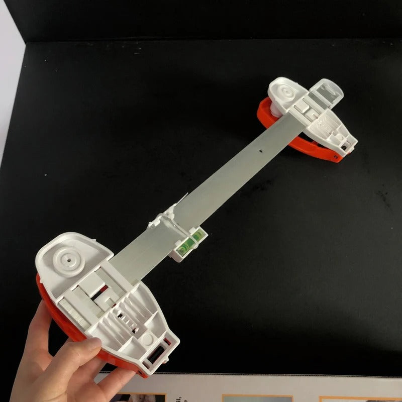 The All-in-One Frame Leveling Tool That Ends Crooked Pictures, Extra Nail Holes, and Wall Patch-Ups for Good